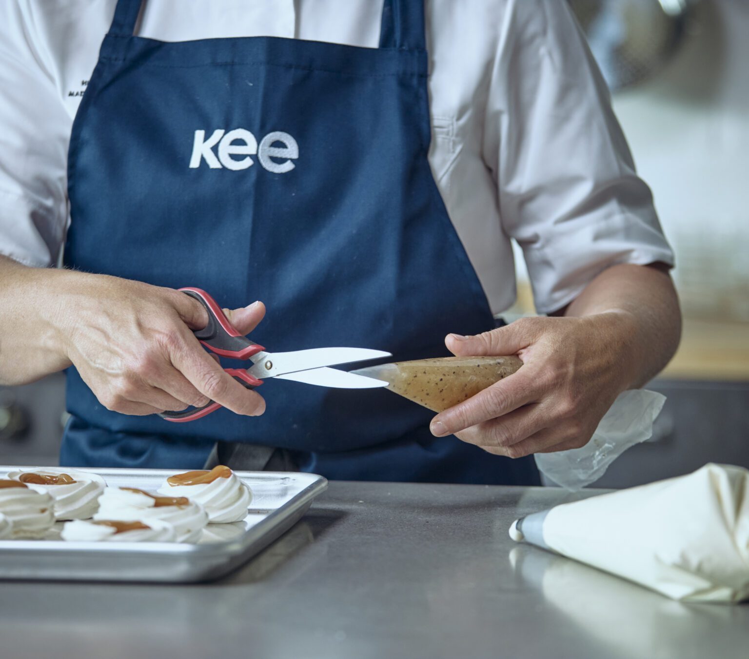 Professional cutting off the tip of Kee-Seal Piping Bag